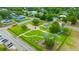 Aerial shot of a public park featuring walking paths, benches and landscaped areas at 509 N Walker St, Plant City, FL 33563