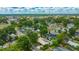 An aerial neighborhood view featuring a mix of tree coverage and buildings at 509 N Walker St, Plant City, FL 33563