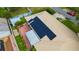 An aerial view of the roof, showing solar panels and brick patio at 509 N Walker St, Plant City, FL 33563