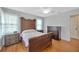 Cozy bedroom with traditional furniture, hardwood floors, and plenty of natural light at 509 N Walker St, Plant City, FL 33563