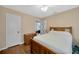 Bedroom featuring hardwood floors, neutral walls, and window with natural light at 509 N Walker St, Plant City, FL 33563