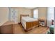 Bedroom featuring hardwood floors, white walls, and window with natural light at 509 N Walker St, Plant City, FL 33563