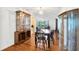 Traditional dining room featuring hardwood floors, classic furnishings, and a vintage chandelier at 509 N Walker St, Plant City, FL 33563