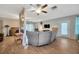 Bright living room showcases wood-look floors, ample seating, and easy access to the outdoors at 509 N Walker St, Plant City, FL 33563