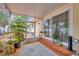 Enclosed patio with sliding glass doors and peaceful outdoor views, creating a serene retreat at 509 N Walker St, Plant City, FL 33563