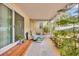 Relaxing enclosed patio with potted plants and comfortable seating, perfect for enjoying the outdoors at 509 N Walker St, Plant City, FL 33563
