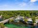 Aerial view of the local waterfront restaurant, nestled on the river and surrounded by lush greenery at 5421 Gay St, Weeki Wachee, FL 34607