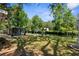 Waterfront backyard featuring a gazebo, lush lawn, and canal views for outdoor entertainment and relaxation at 5421 Gay St, Weeki Wachee, FL 34607