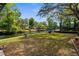 Lush backyard with canal access, offering an inviting space for outdoor relaxation and recreation at 5421 Gay St, Weeki Wachee, FL 34607