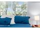 Bedroom with plush bedding, large windows, and a view of the outdoors at 5421 Gay St, Weeki Wachee, FL 34607