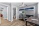 This bedroom features a bunk bed with futon, desk, and wood-look flooring for a functional and stylish space at 5421 Gay St, Weeki Wachee, FL 34607