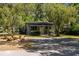 Charming home featuring mature trees, a well-kept yard, and cozy curb appeal at 5421 Gay St, Weeki Wachee, FL 34607