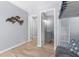 Hallway with bathroom and closet entrances. Sea Turtle wall decor at 5421 Gay St, Weeki Wachee, FL 34607