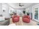 Bright living room with wood floors, comfortable seating, and lots of light at 5421 Gay St, Weeki Wachee, FL 34607