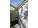 Outdoor shower with modern fixtures and a privacy screen for a refreshing, secluded experience at 5421 Gay St, Weeki Wachee, FL 34607