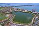 An aerial shot displays a community with a lagoon and a bridge in the distance at 6290 Bahia Del Mar Cir # 12, St Petersburg, FL 33715