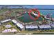 Fantastic aerial view of waterfront property with lush landscaping, community pool, and picturesque lake views at 6290 Bahia Del Mar Cir # 12, St Petersburg, FL 33715
