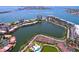 Stunning aerial view showcasing a waterfront community with lush landscaping and serene lake views at 6290 Bahia Del Mar Cir # 12, St Petersburg, FL 33715