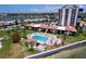 Aerial view of a complex with a pool, landscaping, and water view at 6290 Bahia Del Mar Cir # 12, St Petersburg, FL 33715