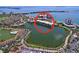 Stunning aerial view showcasing waterfront condos, lush landscaping, and scenic water views in desirable community at 6290 Bahia Del Mar Cir # 12, St Petersburg, FL 33715
