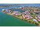 Incredible aerial view of waterfront community boasting lush landscaping, boat docks, and picturesque lake views at 6290 Bahia Del Mar Cir # 12, St Petersburg, FL 33715