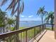 Enjoy stunning water views and palm trees from this relaxing balcony, ideal for outdoor seating and entertaining guests at 6290 Bahia Del Mar Cir # 12, St Petersburg, FL 33715