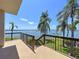 Enjoy stunning water views and palm trees from this relaxing balcony, ideal for outdoor seating and entertaining guests at 6290 Bahia Del Mar Cir # 12, St Petersburg, FL 33715