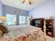 Bedroom with water view, floral bedding, and light purple walls at 6290 Bahia Del Mar Cir # 12, St Petersburg, FL 33715