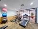 Fitness center with updated equipment and an open view of the game room at 6290 Bahia Del Mar Cir # 12, St Petersburg, FL 33715