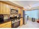 Bright kitchen features stainless appliances, including range, microwave, and refrigerator at 6290 Bahia Del Mar Cir # 12, St Petersburg, FL 33715