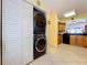 Laundry room featuring stackable washer and dryer units and plenty of storage space at 6290 Bahia Del Mar Cir # 12, St Petersburg, FL 33715