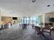 Spacious living room featuring comfortable seating, large windows showcasing picturesque water views, and stylish decor at 6290 Bahia Del Mar Cir # 12, St Petersburg, FL 33715
