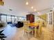 Open concept living and dining area features views of the canal and updated features at 6290 Bahia Del Mar Cir # 12, St Petersburg, FL 33715