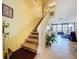 Elegant staircase leading to an open-concept living area with water views at 6290 Bahia Del Mar Cir # 12, St Petersburg, FL 33715