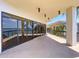 Expansive patio with sliding glass doors offering stunning water views, ideal for outdoor relaxation and entertainment at 6290 Bahia Del Mar Cir # 12, St Petersburg, FL 33715