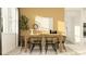 Inviting dining room featuring a wood table, black chairs, art and decorative vases at 6837 E 115Th St, Palmetto, FL 34221