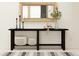 Elegant entryway featuring a dark console table, decorative mirror, and stylish decor at 6837 E 115Th St, Palmetto, FL 34221