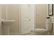 Neat bathroom featuring a pedestal sink, toilet, and fresh neutral tones throughout at 6905 E 116Th Ct, Palmetto, FL 34221