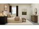 Tastefully decorated bedroom featuring neutral colors, modern art, and ample natural light at 6905 E 116Th Ct, Palmetto, FL 34221