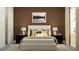 Cozy bedroom showcases a comfortable bed, lamps, and a calming color scheme for relaxation at 6905 E 116Th Ct, Palmetto, FL 34221