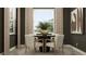 Cozy dining area with a round table, four chairs, and neutral decor for comfortable meals at 6905 E 116Th Ct, Palmetto, FL 34221