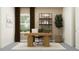 Bright home office featuring a modern desk, shelving, and large window for a productive workspace at 6905 E 116Th Ct, Palmetto, FL 34221