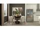 Kitchen and dining area featuring a stainless steel refrigerator and a round table with seating for four at 6905 E 116Th Ct, Palmetto, FL 34221