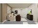 Tastefully designed living room featuring stylish furniture, neutral colors, and seamless access to other areas of the home at 6905 E 116Th Ct, Palmetto, FL 34221