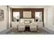 Comfortable main bedroom with two armchairs, two large windows, and neutral tones for relaxation at 6905 E 116Th Ct, Palmetto, FL 34221