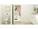 Bathroom with white vanity and toilet area with a view into the bedroom at 6909 E 116Th Ct, Palmetto, FL 34221