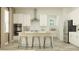 Bright kitchen features white cabinetry, stainless steel appliances, granite countertops, and a central island at 6909 E 116Th Ct, Palmetto, FL 34221
