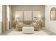 Comfortable living room featuring neutral tones, modern decor, and natural light at 6909 E 116Th Ct, Palmetto, FL 34221