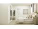 Light, airy bedroom with full length mirror, potted tree, framed artwork, and a closet at 6909 E 116Th Ct, Palmetto, FL 34221