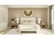 Relaxing main bedroom featuring king bed, decorative wall art, and warm, neutral-toned decor at 6909 E 116Th Ct, Palmetto, FL 34221